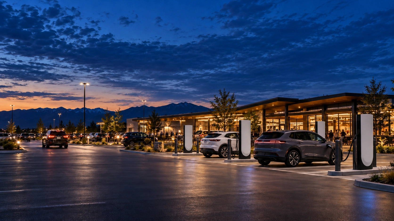 EVs charging at Tesla V4 stalls beside shops at dusk
